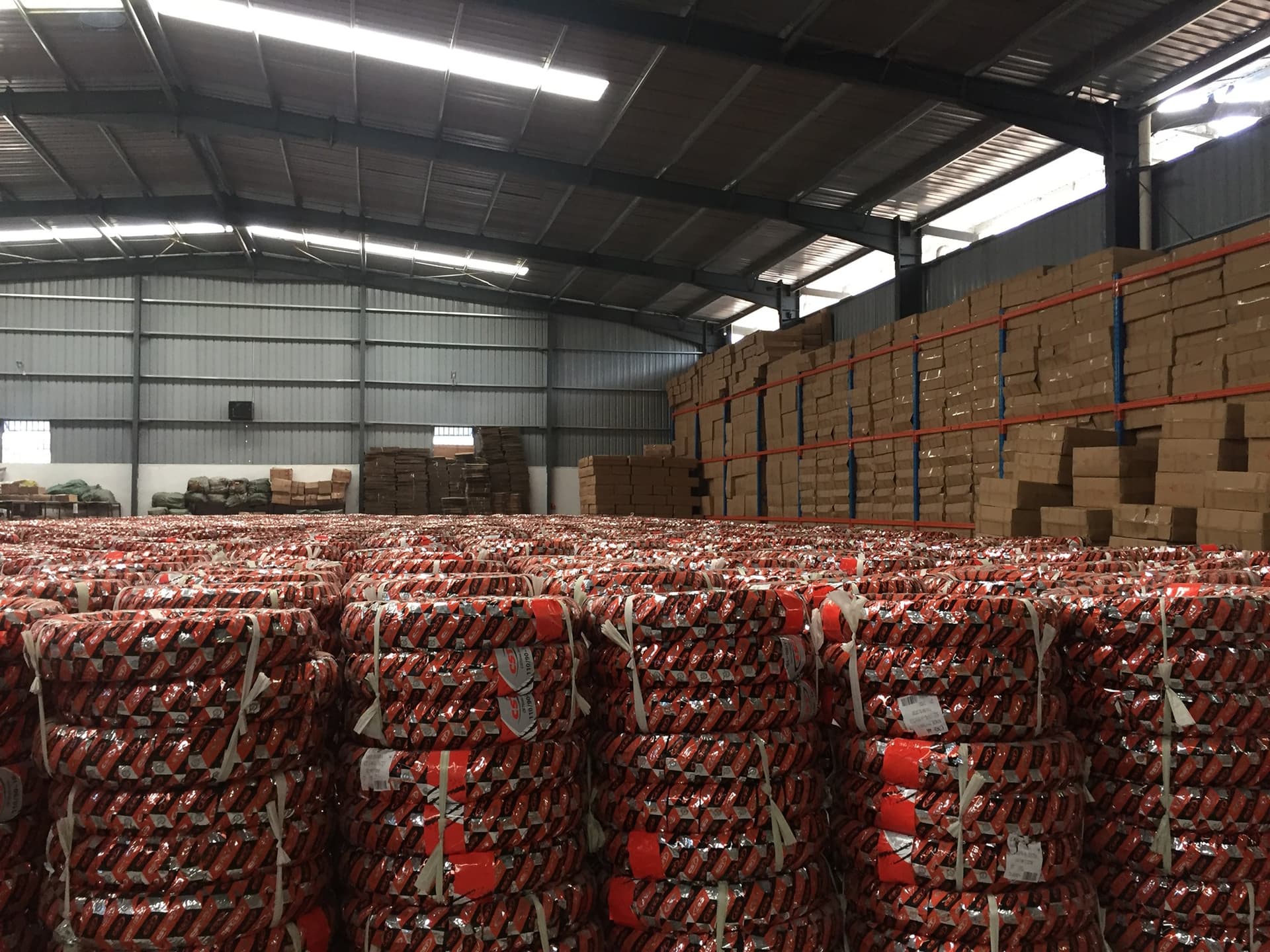 HONLG warehouse inventory supporting genuine motorcycle spare-parts supply in Tanzania
